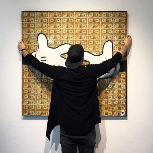 Artist with artworks